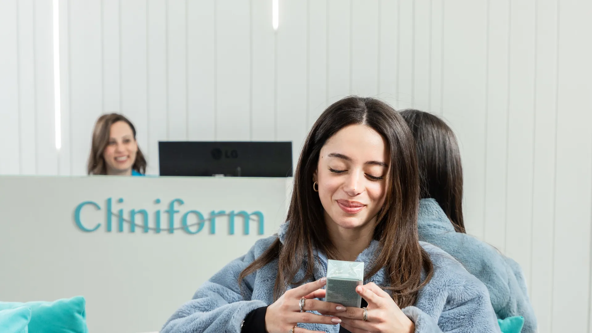 A patient relaxing in the Cliniform lounge with a drink